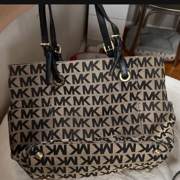 Michael Kors Bags A Brown Michael Kors Purse With The Mk Logo In Black Poshmark